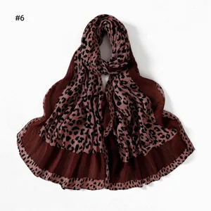 Detailed close-up view of the stylish pleated leopard print long scarf showing soft texture and fine folds.