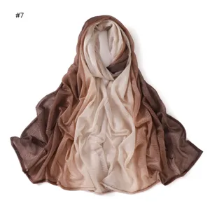 Detail view of the gradient brown pleated scarf, lightweight soft crinkle hijab texture.