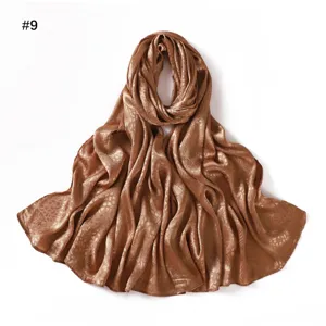 Detailed view of the silky satin jacquard long scarf showing soft texture and elegant leaf pattern.