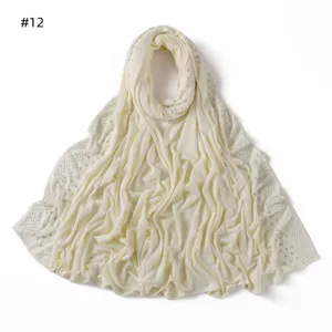 Solid color mercerized cotton jersey long scarf with side rhinestones and breathable design.