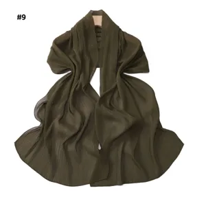 Dark green pleated metallic shimmer chiffon scarf detail, soft breathable shawl texture view.
