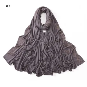 Detailed view of grey purple modal cotton long hijab scarf with rhinestone paisley patterns.