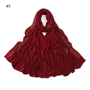 Wine red mercerized cotton long hijab scarf featuring elegant rhinestone paisley wave details.