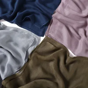 Detailed view of solid color modal linen scarf fabric texture, lightweight breathable shawl.