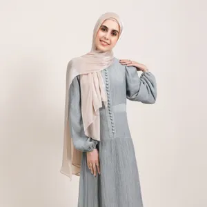 Elegant shiny satin hijab and matching long sleeve dress for women, smooth texture design.