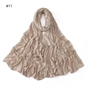Close-up detail of the mercerized cotton hijab scarf featuring exquisite rhinestone wave patterns.