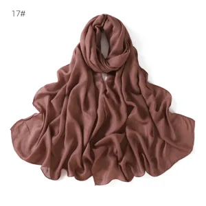 Brown modal cotton linen scarf detail showing thin breathable fabric and single-needle edges.