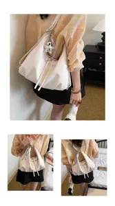 Sac à dos blanc polyvalent pour femme, sac à bandoulière décontracté avec pendentif étoile.