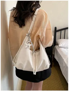 Sac à dos bandoulière polyvalent pour femme avec pendentif étoile élégant pour le bureau.