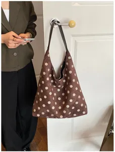 Brown suede polka dot shoulder bag detail view, casual large capacity tote bag scene display.