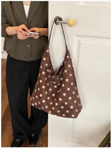 Brown suede polka dot shoulder bag, soft hobo tote bag with spacious interior for daily use.