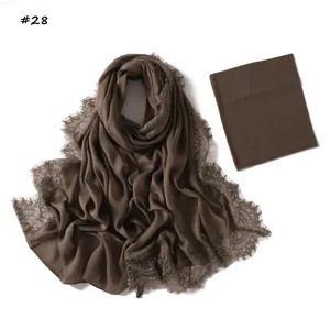 Detail view of the dark brown modal rayon lace long scarf with matching elastic undercap.