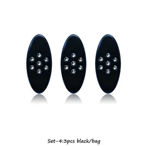Oval black anti-glare scarf pin set with rhinestone plum blossom design detail view.