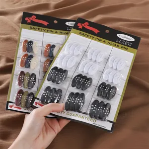 Colorful oval plastic safety pins hijab clips with rhinestones detail view showing packaging.