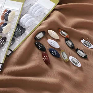 Detail shot of multi-color oval rhinestone anti-glare pins, perfect for scarves and shawls.