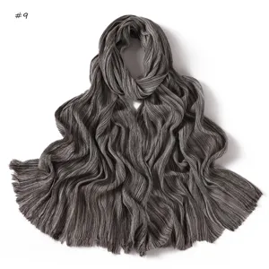 Detailed view of the soft pleated fringe scarf, showing fine texture and striped pattern.