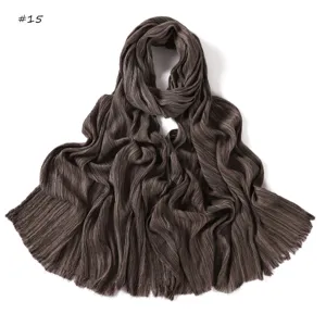 Detailed view of dark brown crinkled cotton linen long scarf featuring stylish fringe edges.