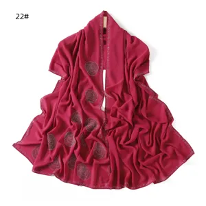 Elegant fuchsia chiffon scarf with sparkling rhinestone swirl patterns and beaded edge trim.