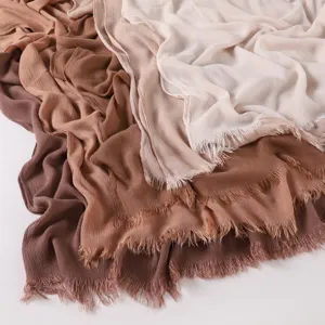 Soft crinkled rayon long scarf showcasing breathable texture, fringed edges and gradient tones.