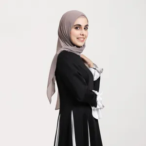 Details view of the elegant grey chiffon hijab paired with chic black modest dress.