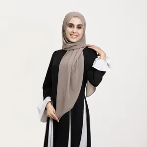 Detailed close-up view showcasing the exquisite details of the modest maxi dress and hijab.
