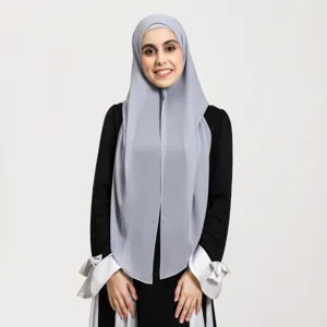 Detailed view of grey chiffon magnetic hijab hood set with elegant black dress and white cuffs.
