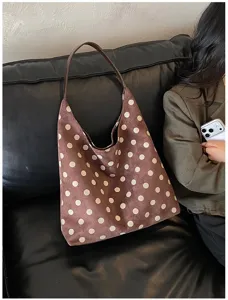 Detailed view of brown suede polka dot shoulder bag, vintage style hobo tote for women daily use