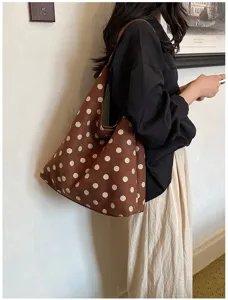 Brown polka dot suede hobo shoulder bag detail shot, vintage large capacity everyday tote.
