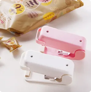 Mini sigillatore termico per sacchetti di plastica portatile bianco e rosa due pezzi