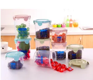 Transparent plastic food storage jars with airtight lids, ideal for kitchen pantry organization.