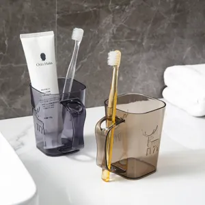 Detailed view of transparent plastic toothbrush cup with deer pattern and convenient handle.
