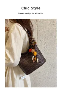 Stylish dark brown woven shoulder bag for women, chic bucket bag design with cute charms.