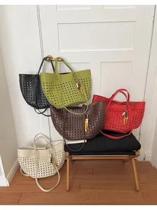Detail shot of multi-color woven cutout tote bags displayed together, showcasing style and capacity.