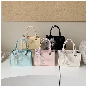 Dames mode mini schoudertas handtas met parel strik elegante PU leer geweven crossbody tas