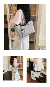 Nahaufnahme der stilvollen Shopper Tasche mit Bären Anhänger für den täglichen Weg zur Arbeit.