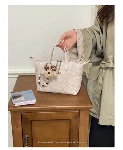 Woven dumpling handbag for women, stylish minimalist retro tote bag for daily commute and casual use.