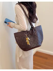 Dark brown woven hollow tote bag for women, vintage large capacity shoulder bag for autumn.