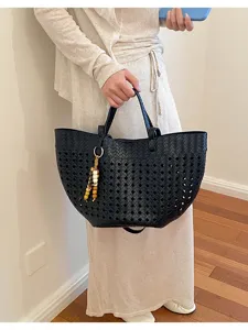 Stylish black woven leather tote bag for women, large capacity retro shoulder bag.