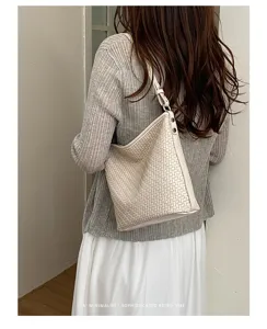 Elegant beige woven leather shoulder bag for women, stylish minimalist hobo purse for daily work.