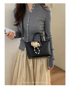 Woven dumpling bag for women, stylish top-handle crossbody handbag for daily autumn commute.