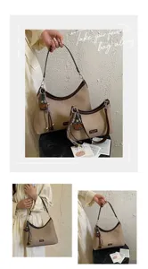Detail view of vintage canvas shoulder bag with tassel charm, stylish everyday purse.