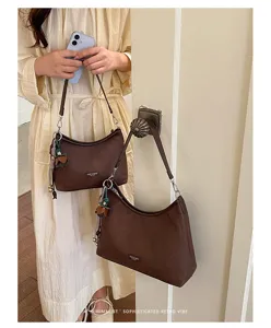 Brown vintage shoulder bag, retro minimalist aesthetic stylish autumn fashion accessory.