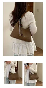 Large capacity retro shoulder bag for women, versatile autumn underarm hobo bag with charms.