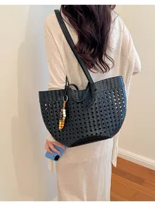 Black woven hollow tote bag for women, retro fashion autumn large shoulder commuting bag.