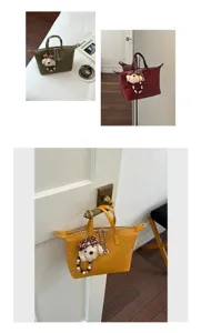 Woven dumpling handbag detail showcasing stylish texture, cute pendant and versatile daily design.