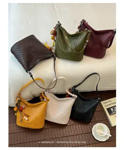 Detailed showcase of diverse retro woven bucket bags displaying multiple colors and textures.