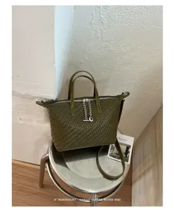 Elegant olive green woven top handle bag with chic chain detail, versatile retro style for daily use.
