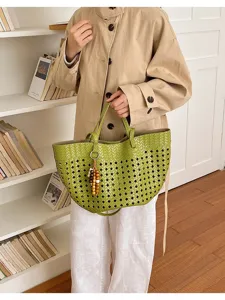 Chic woven hollow-out tote bag for women, vintage style large capacity shoulder bag for daily commute.