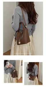 Minimalist retro leather bucket bag for women, chic handbag and stylish crossbody bag daily.