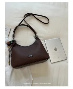 Vintage brown hobo shoulder bag detailed view, minimalist retro style daily crossbody purse.